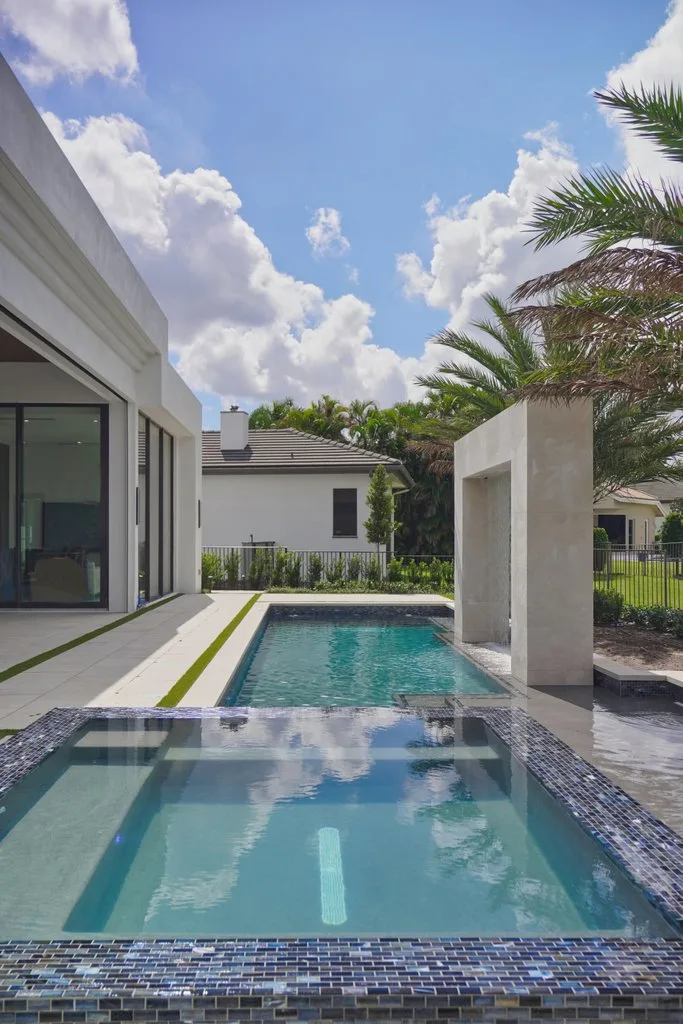 Completed backyard pool and spa, custom pool and spa in Boca Raton, FL