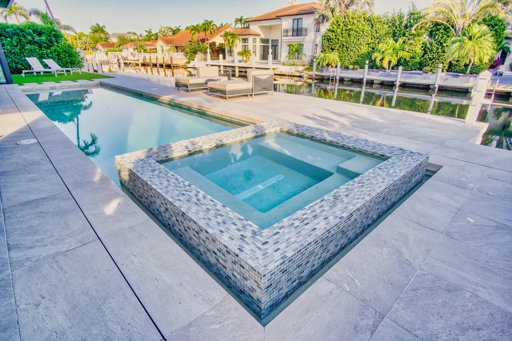 Finished glass tile spa on the waterfront, custom pool builder in Boca Raton, FL