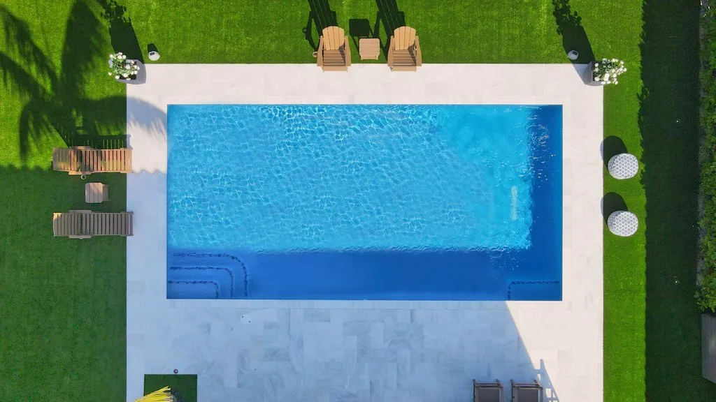 Top-down drone view of rectangular pool and deck, Klays Court, Royal Palm Beach