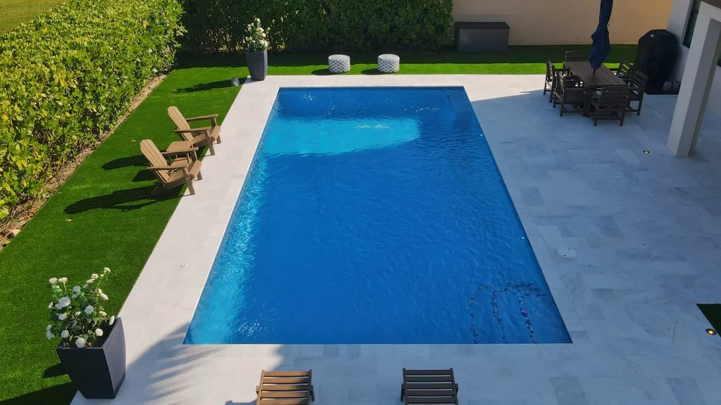 Aerial side view of backyard pool layout in Royal Palm Beach