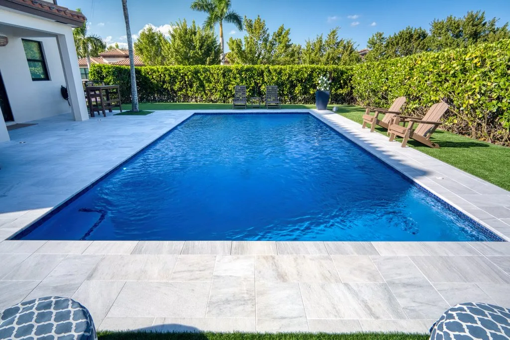 Finished pool with Azure plaster and marble deck