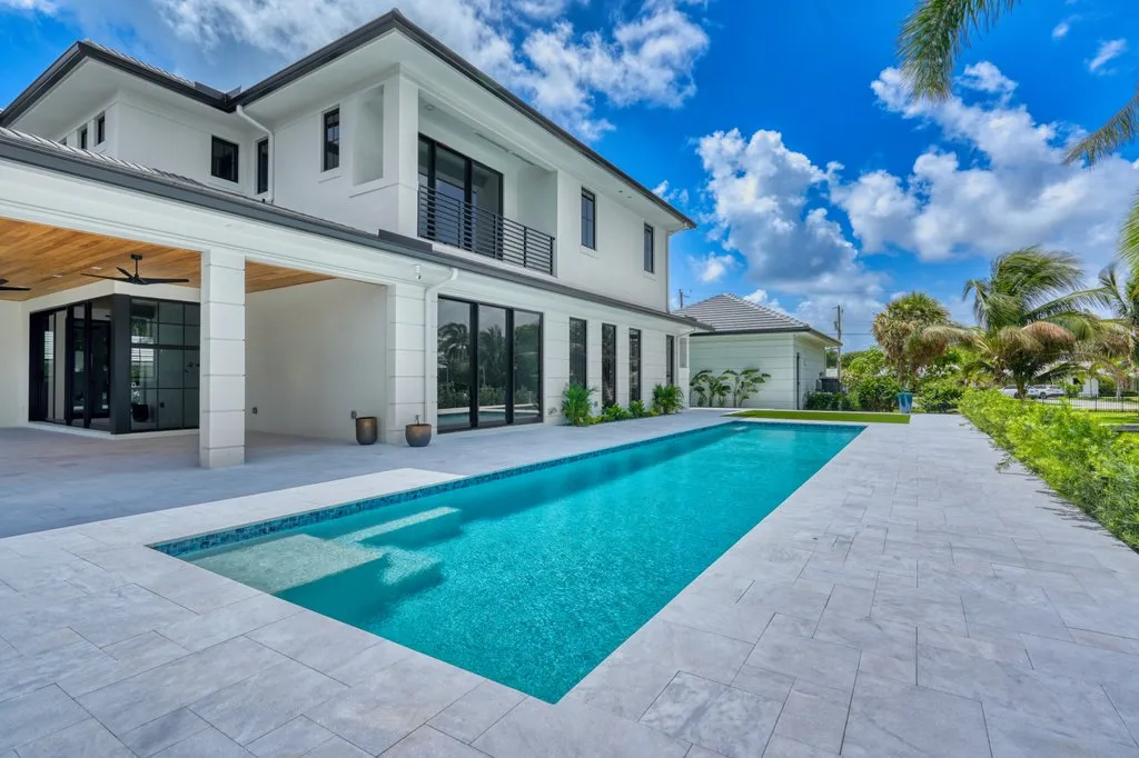 Sun shelf and corner steps with glass tile waterline, custom pool builder in North Palm Beach, FL