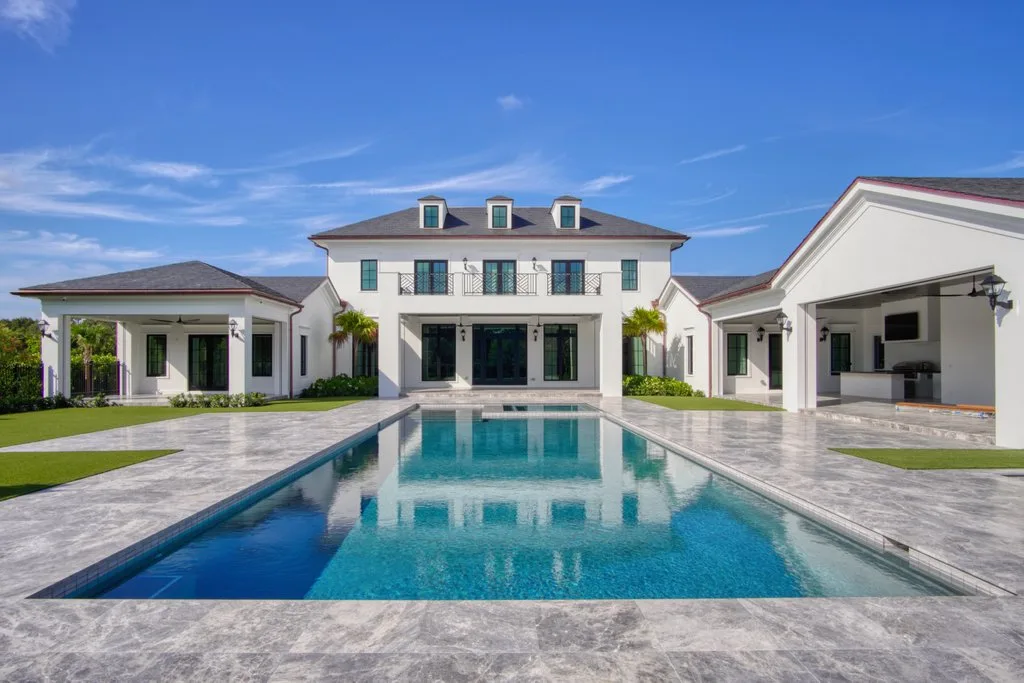 Finished pool reflecting the estate home, custom pool builder in Jupiter, FL