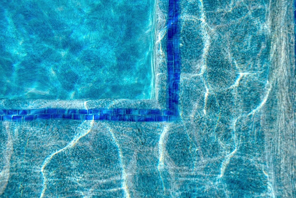 Blue glass tile raised wall with sheer descent water feature, Boynton Beach pool