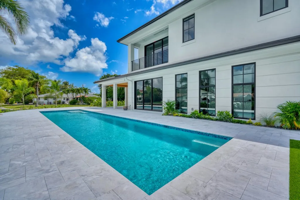 Pool along the rear of the new home, custom pool builder in North Palm Beach, FL